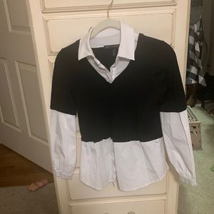 One piece. Black and white , blouse. Looks like two pieces.